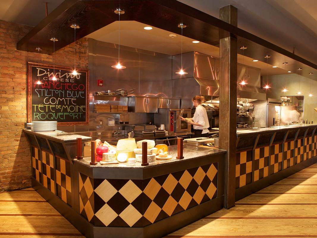 Divino restaurant kitchen and cheese counter with pendant lighting